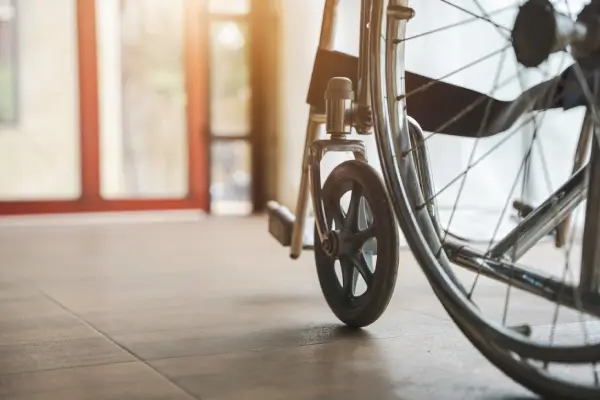 Close up view of empty wheelchair waiting for patient services with vintage filtered.